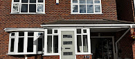 Kenilworth style composite door in Agate Grey with Profile 22 UPVC bay windows installed in Aintree, Merseyside.